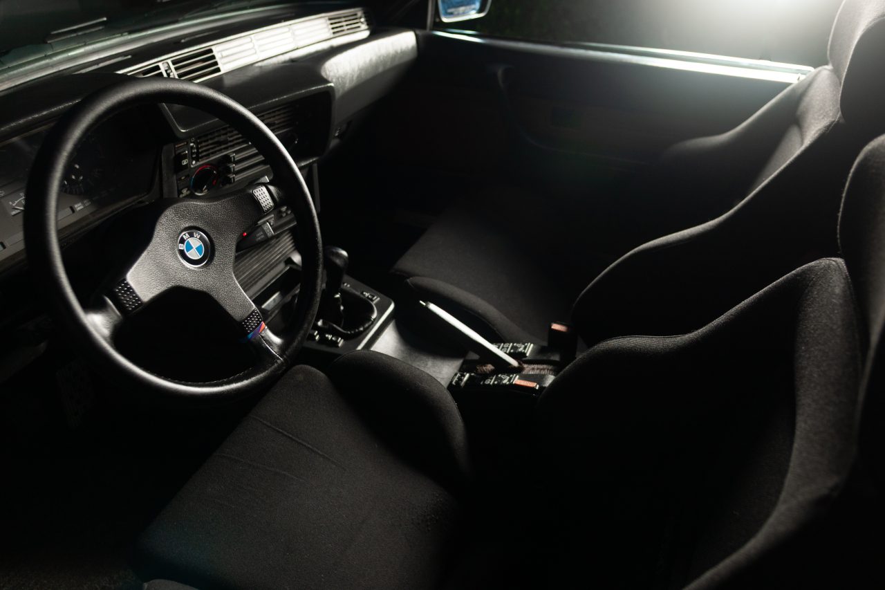 Product photography of the interior of a 1987 BMW 635CSi coupe