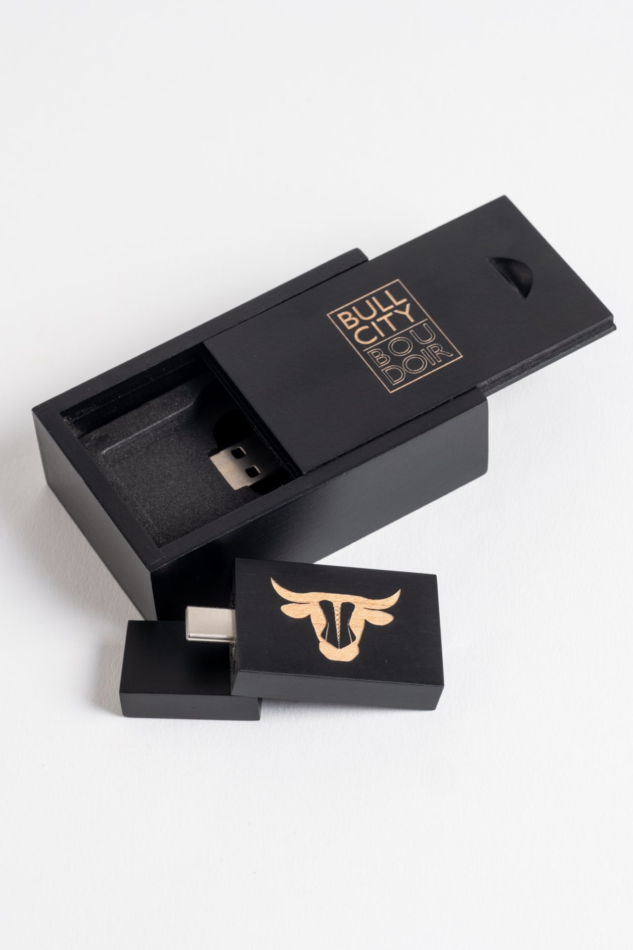 Product photography of a Bull City Boudoir USB drive.